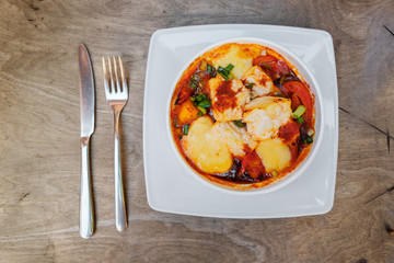 Fresh tomato cake with cheese on a gray wooden background