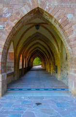 Fototapeta na wymiar Gothic medieval church stone arches. Arch cloister.