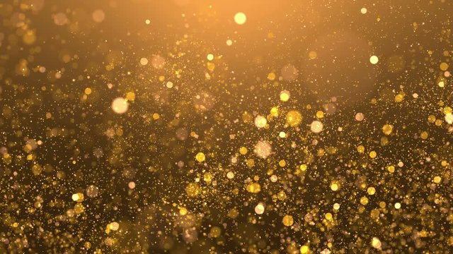 Glittering golden sparks flying in a blurred background. 4K UHD video loop animation.