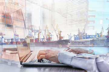 Businessman using laptop, close up
