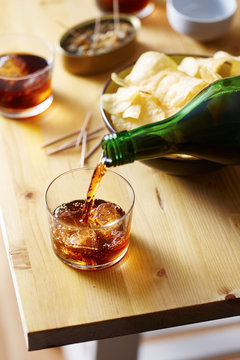Pouring vermouth on a glass