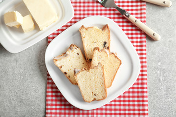 Composition with delicious butter cake on table