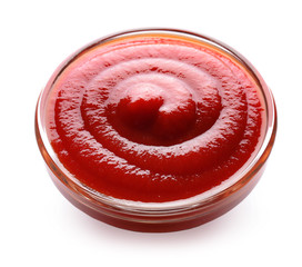 Glass bowl with tomato sauce on white background