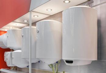 Variety of modern electric boilers presented in store