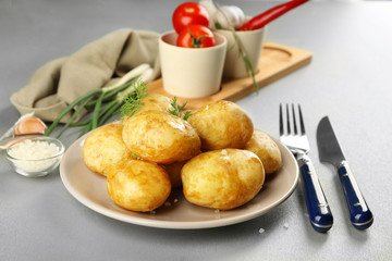 Composition with boiled potatoes on table