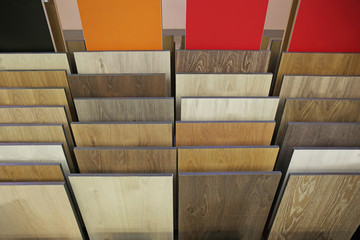 Assortment of laminated flooring samples in hardware store