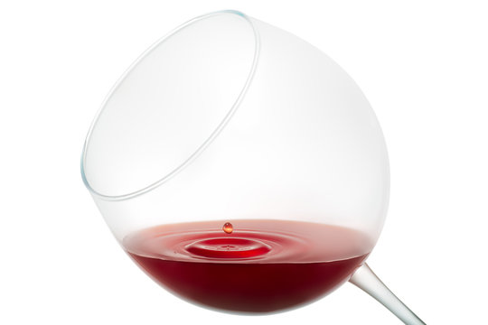 Wine drop splashing on glass isolated on white background