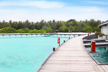 Wooden pontoon bridge at tropical resort