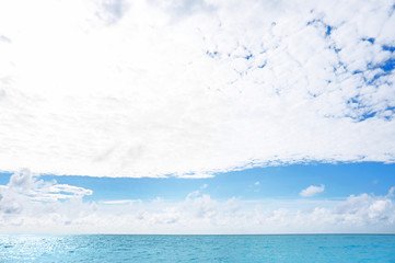 Naklejka na ściany i meble View of blue sea and beautiful sky with clouds
