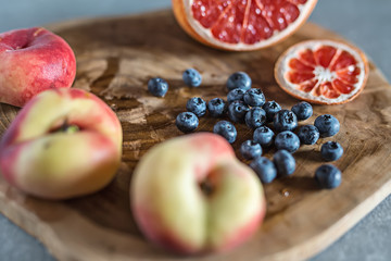 Juicy fruit on wooden board