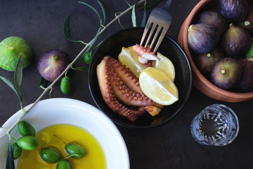 Baked octopus.  Olive oil and ripe figs.
