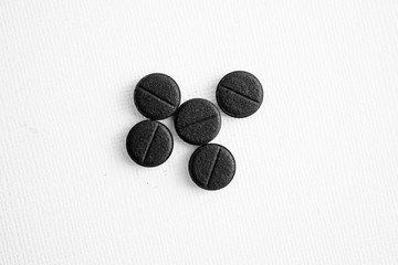 Activated charcoal on white top