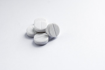 White tablets on a white background