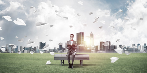 Young businessman or student studying the science and paper plan