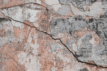 an old wall crack in the wall , stone texture