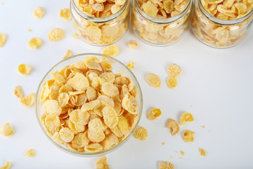 Cornflakes in bowl on a white background