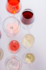 Glasses with red, white and rose wine, top view scene