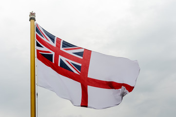 Belfast, Northern Ireland. 26/07/2014 - The White Ensign flies on the aft of a Royal Navy ship.