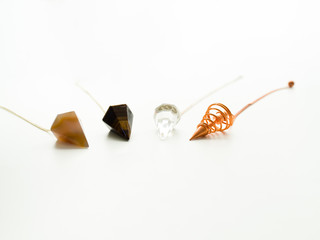 Tumbled pendulum stones for crystal therapy treatments and reiki detail
