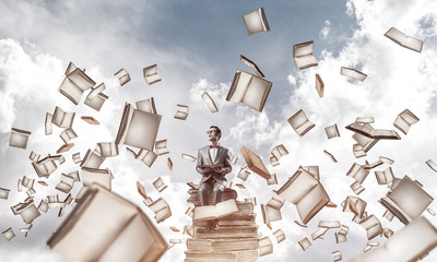 Young businessman or student studying the science and books fly 
