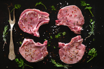 Seasoned raw pork steaks