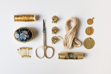 Golden Items Arranged on a White Background