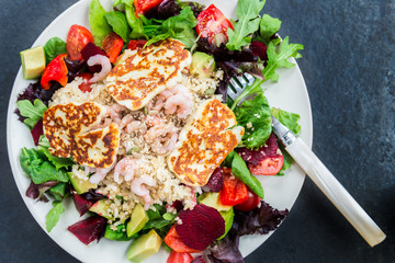 Warm Salad from Brown Rice, Quinoa, Prawns, Halloumi and Veg