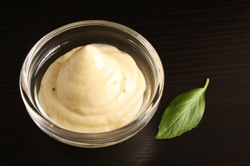Mayonnaise dressing salad on a black background