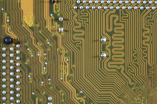 close-up of electronic circuit golden board background of computer motherboard.