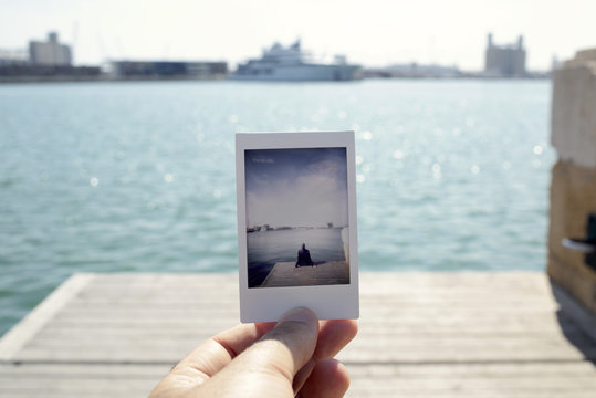 man sitting in a dock