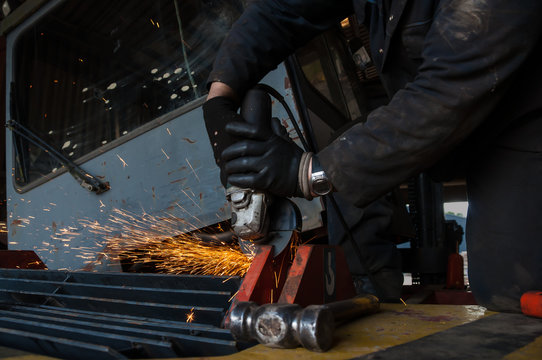 Orange Sparks Fly From An Angle-grinder