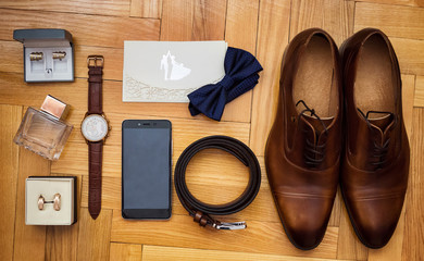 bow tie,shoes,belt, wedding rings in box,telephone,clock,parfumes,cufflinks,Invitation card,the...