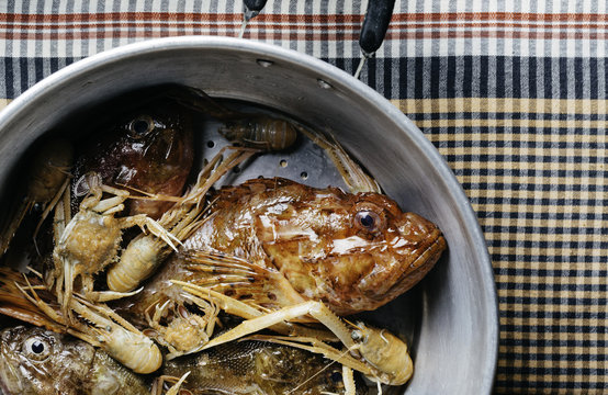 Paella And Bouillabaisse Ingredients In A Pot.