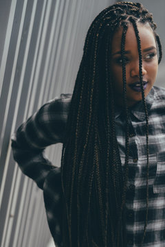 Portrait of a woman with braids