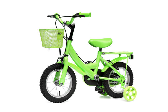 Fototapeta A green bike with training wheels on isolated background