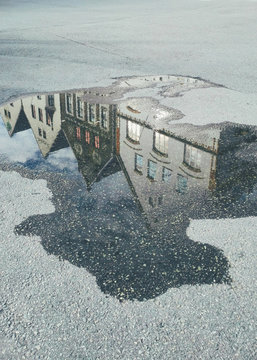Bergen 1900's Houses reflected in a puddle