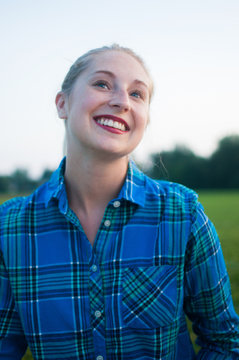 A portrait of a blonde woman in her twenties