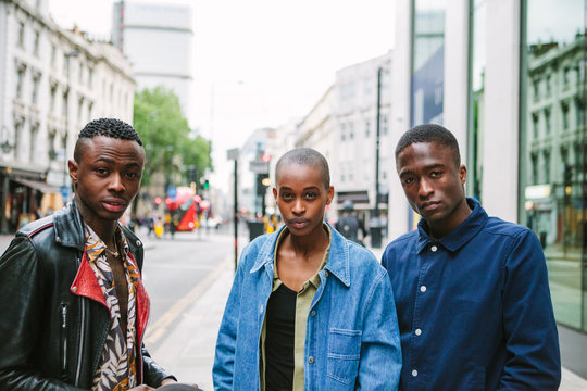 Three Fashionable friends in an urban setting