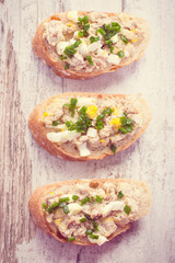 Vintage photo, Baguette with fresh mackerel fish paste, egg and chives