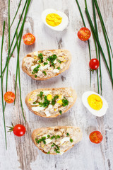 Baguette with mackerel fish paste and ingredients for preparing sandwiches