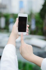 young woman use smart phone in modern city