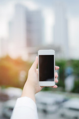 young woman use smart phone in modern city