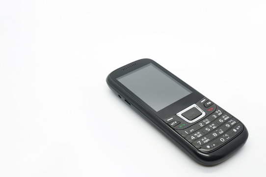 The old mobile phone on white background