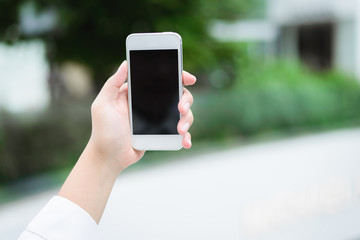 Closeup of woman hands using smartphone
