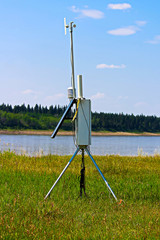 A weather monitoring station beside a river