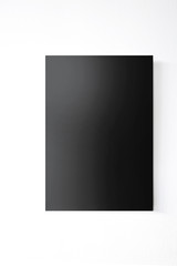 Empty blank black board on the wall.