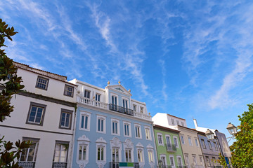 Fototapeta na wymiar Sunny day in Ponta Delgada, Azores capital city, Portugal. Facades of buildings under the blue sky with clouds in summer.