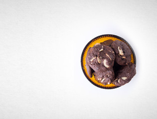 Cookies or Almonds chocolate cookies on background.