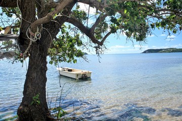 Small fishing  boat floating on the ocean