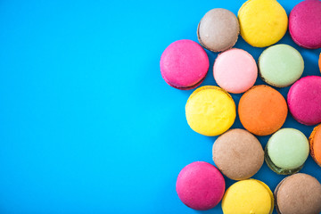 Border background, colorful macaroon cookies